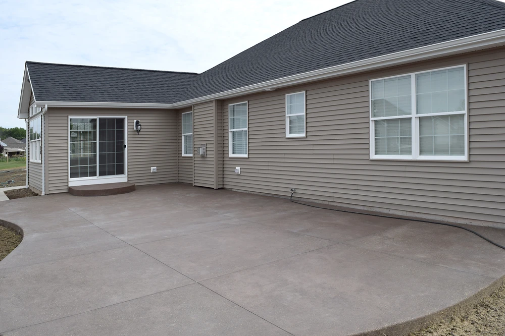 New concrete patio poured with proper base prep to ensure lasting stability and durability.